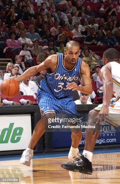 Grant Hill of the Orlando Magic drives against the New Orleans Hornets on February 13, 2005 at TD Waterhouse Centre in Orlando, Florida. NOTE TO...