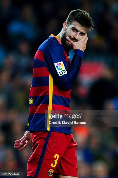 Gerard Pique of FC Barcelona reacts after missing a chance to score during the La Liga match between FC Barcelona and Valencia CF at Camp Nou on...