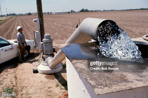 meter reader at pumping station - wasserpumpanlage stock-fotos und bilder