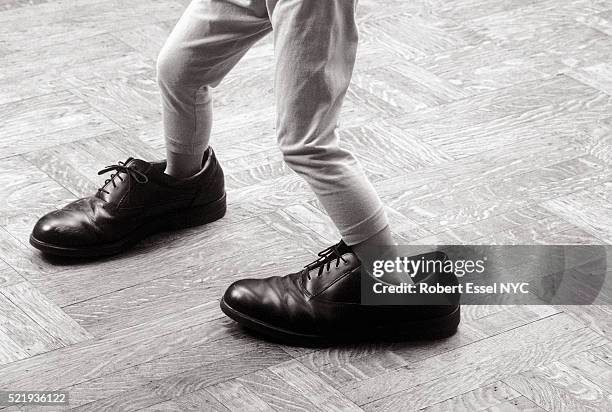 big shoe shuffle - kid in big shoes stock pictures, royalty-free photos & images