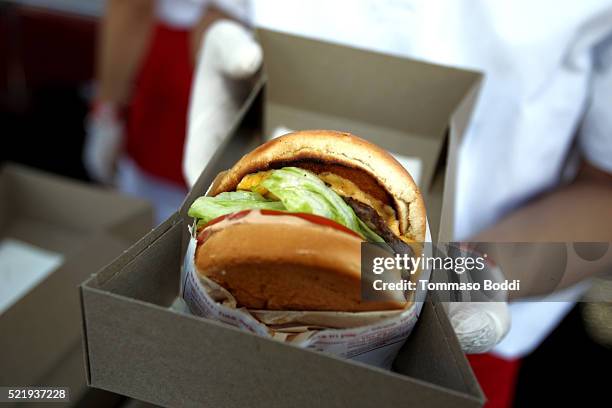 In-N-Out Burgers are served at the John Varvatos 13th Annual Stuart House benefit presented by Chrysler with Kids' Tent by Hasbro Studios at John...