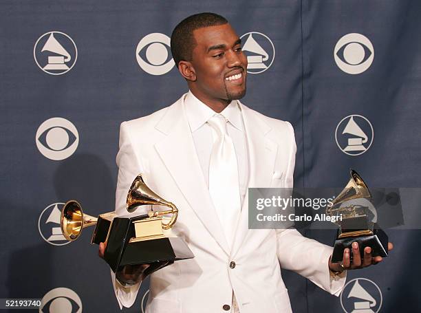 Kanye West poses backstage with his awards for "Best Rap Album", "Best Rap Song", and "Best R & B Song" during the 47th Annual Grammy Awards at the...