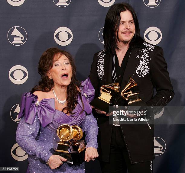 Loretta Lyne and Jack White pose backstage with their awards for "Best Country Collaboration With Vocals" during the 47th Annual Grammy Awards at the...