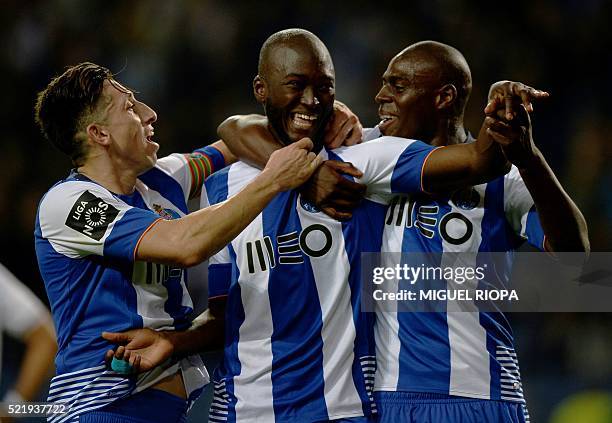 Porto's midfielder Danilo Pereira celebrates with teammates Dutch defender Bruno Martins Indi and Mexican midfielder Hector Herrera after scoring a...