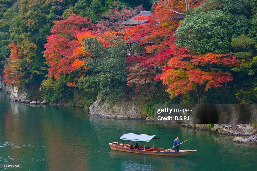 People in a small boat on the Hozu River