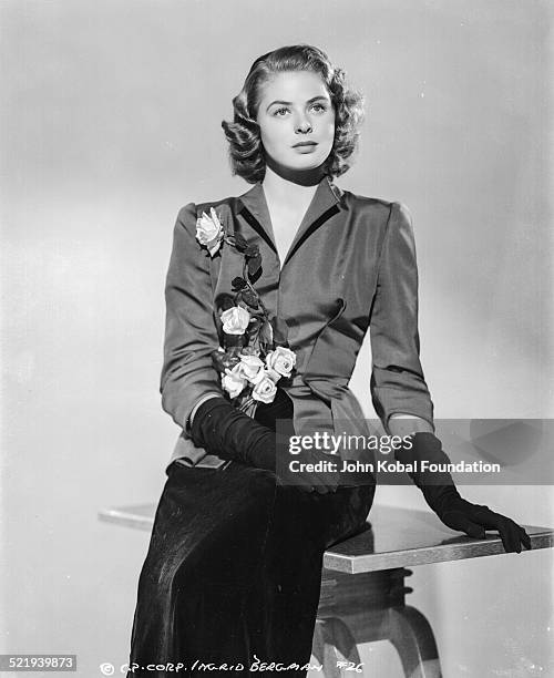 Swedish actress Ingrid Bergman , in a promotional shot for Columbia Pictures, wearing a black suit and gloves, 1941.