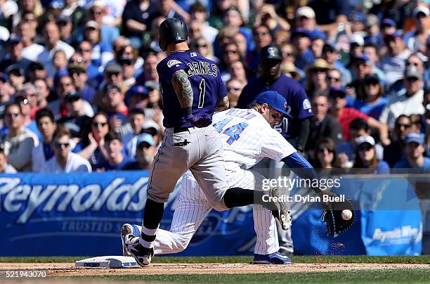 Anthony Rizzo of the Chicago Cubs forces out Brandon Barnes of the Colorado Rockies in the eighth inning at Wrigley Field on April 17, 2016 in...