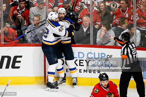 David Backes of the St. Louis Blues hugs Patrik Berglund after Berglund scored against the Chicago Blackhawks in the third period of Game Three of...