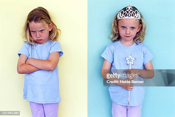 sister pouting over her twin sister's crown and magic wand - jealous sister stock pictures, royalty-free photos & images