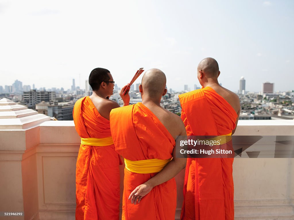 Buddhist monks at Wat Saket overlooking Bangkok