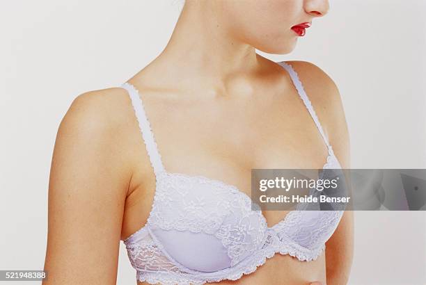 young woman wearing white bra - ブラジャー ストックフォトと画像