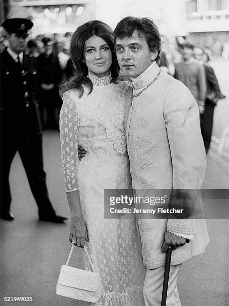 English actor David Hemmings with his wife, American actress Gayle Hunnicutt at a London premiere, 1968.