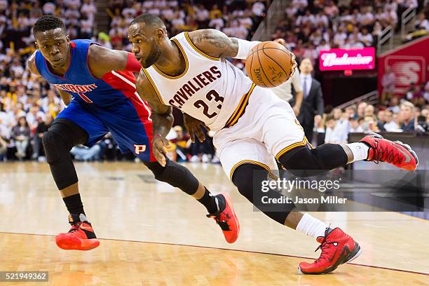 LeBron James of the Cleveland Cavaliers drives Reggie Jackson of the Detroit Pistons during the second quarter of the NBA Eastern Conference...