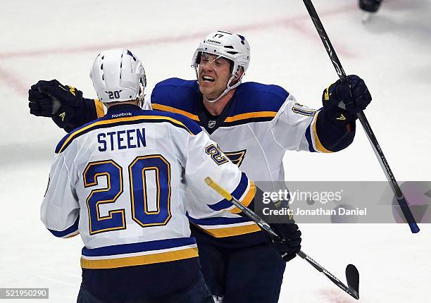 Jaden Schwartz of the St. Louis Blues celebrates his game-winning goal against the Chicago Blackhawks with teammmate Alexander Steen in Game Three of...