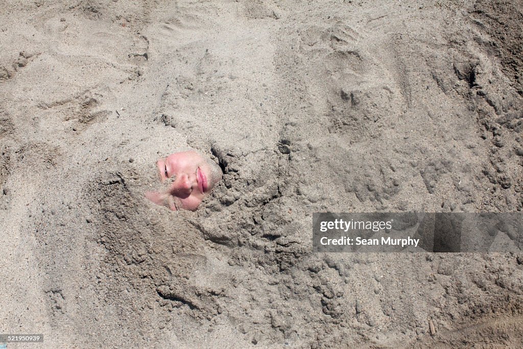 Boy Buried in Sand
