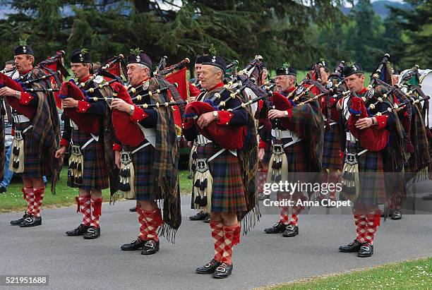 bagpipers of the atholl highlanders standing in formation - blair atholl castle stock pictures, royalty-free photos & images