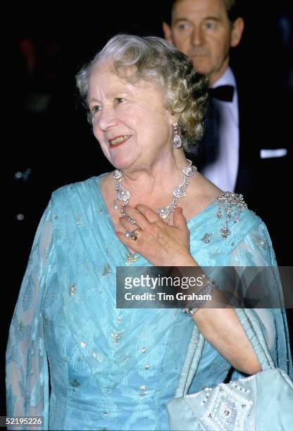 The Queen Mother at an evening engagement wearing the ring later given to Camilla Parker-Bowles as an engagement ring. The necklace had been a gift...
