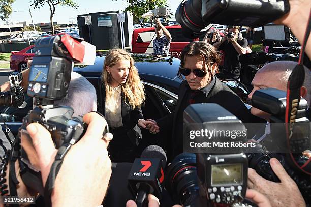 Johnny Depp and Amber Heard arrives at Southport Magistrates Court on April 18, 2016 in Gold Coast, Australia. Heard is facing two counts of...