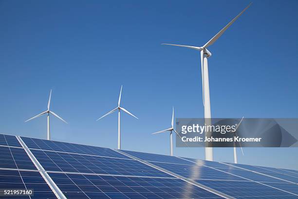 solar panels and wind turbines - renewable energy stock pictures, royalty-free photos & images