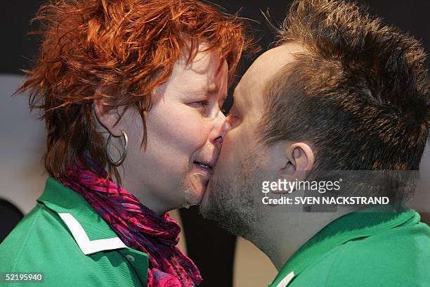 Clara Ahlstroem and 41-year-old Hannu Kiviaho, a Swedish couple attempting to break the world record for the longest kiss, are pictured in Nacka...