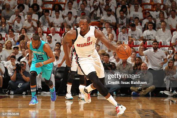 Luol Deng of the Miami Heat drives to the basket against the Charlotte Hornets during Game One of the Eastern Conference Quarterfinals of the 2016...