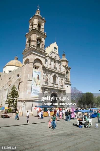 worshippers exiting san marcos temple after easter mass - aguas calientes stock pictures, royalty-free photos & images