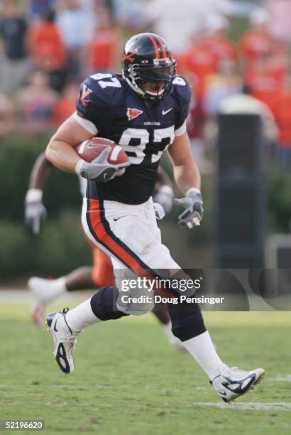 Tight end Patrick Estes of the Virginia Cavaliers runs upfield against the Syracuse Orangemen at Scott Stadium on September 25, 2004 in...