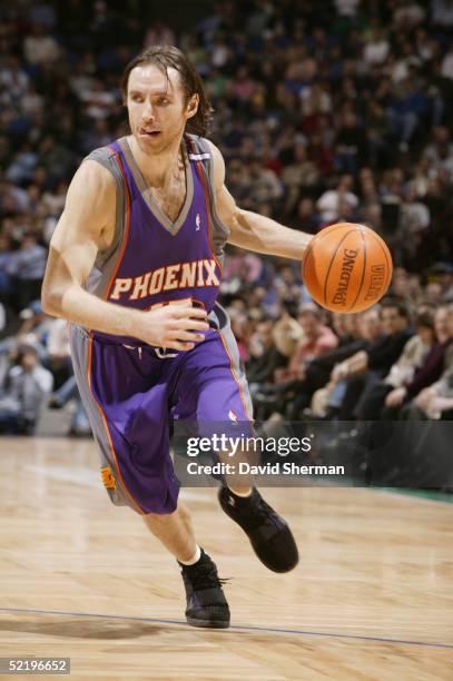 Steve Nash of the Phoenix Suns drives against the Minnesota Timberwolves during the game at Target Center on February 2, 2005 in Minneapolis,...