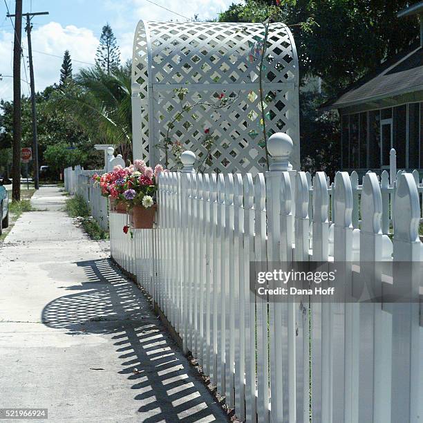 white picket fence and trellis gate with flower box - white picket gate stock pictures, royalty-free photos & images