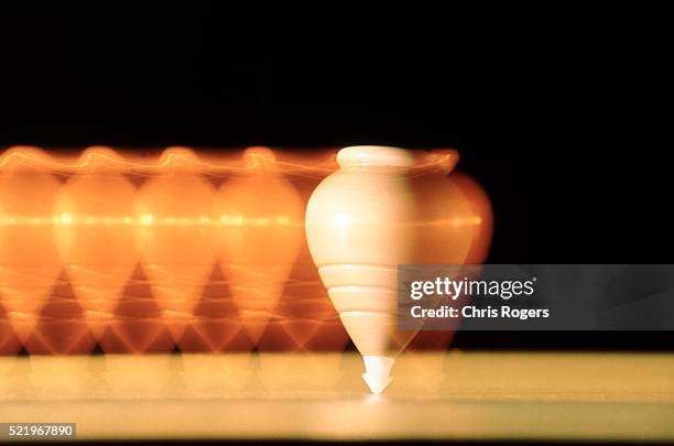 a spinning top / balance - spinning top stock pictures, royalty-free photos & images