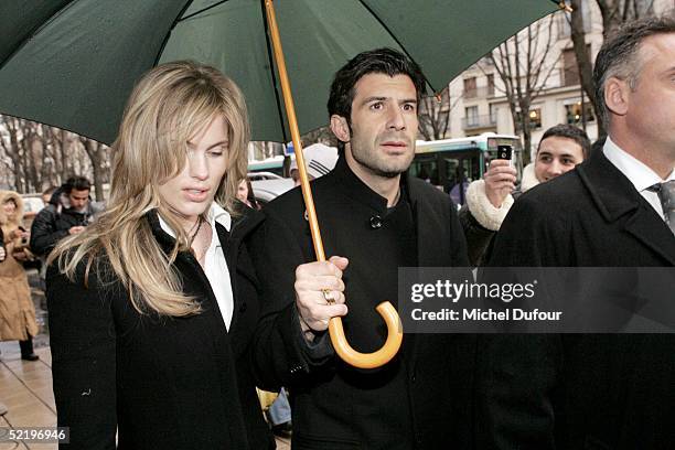 Portugese footballer Luis Figo and wife Helena leave their Paris hotel, The Plaza, to attend Real Madrid teammate Ronaldo's engagement party at...
