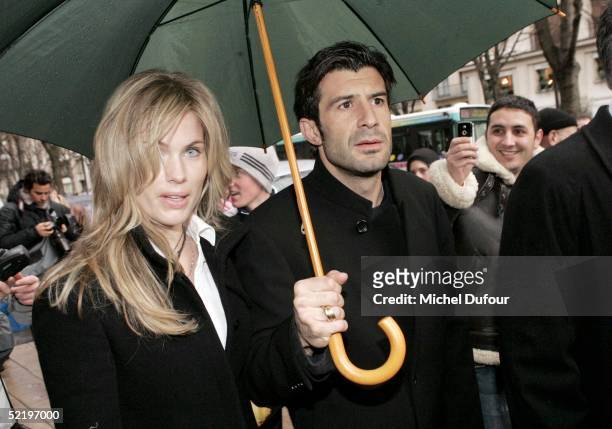 Portugese footballer Luis Figo and wife Helena leave their Paris hotel, The Plaza, to attend Real Madrid teammate Ronaldo's engagement party at...