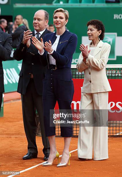 Prince Albert II of Monaco, Princess Charlene of Monaco and Elisabeth Anne de Massy applaud after the singles final match between Rafael Nadal of...