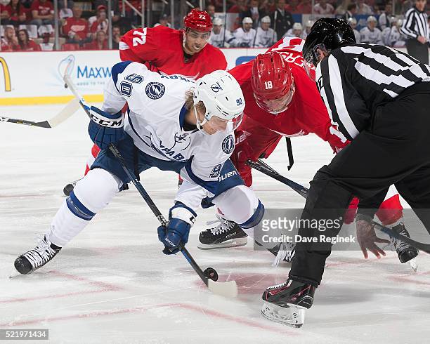 Vladislav Namestnikov of the Tampa Bay Lightning faces off against Joakim Andersson of the Detroit Red Wings during Game Three of the Eastern...