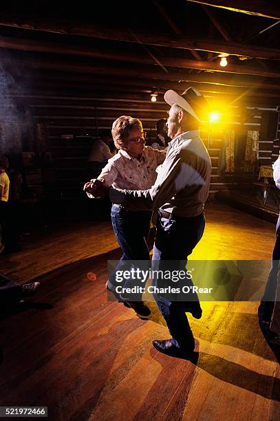 couple dancing after a rodeo - cariboo stock pictures, royalty-free photos & images