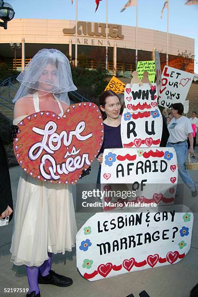 Gay and lesbian activists picket outside the Alltel Arena in opposition to an event celebrating covenant marriages February 14, 2005 in Little Rock,...