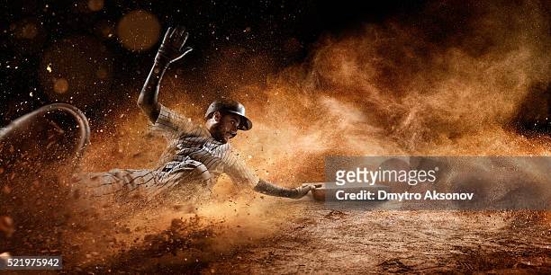 sliding on third base - baseball stock pictures, royalty-free photos & images
