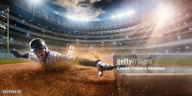 sliding on third base - baseball sport stock pictures, royalty-free photos & images