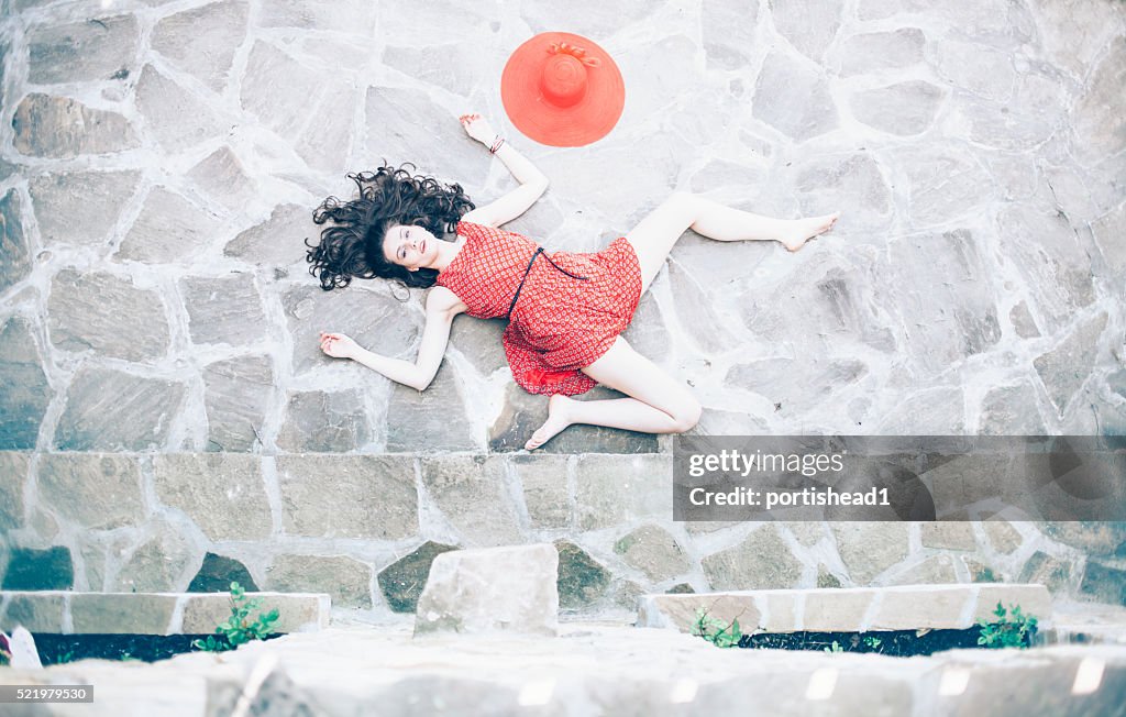 Fallen woman body lying on ground