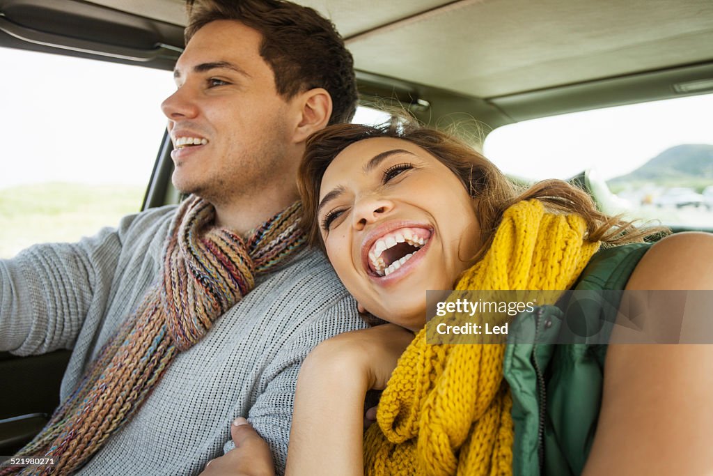Young couple laughing whilst driving, Cape Town, Western Cape, South Africa
