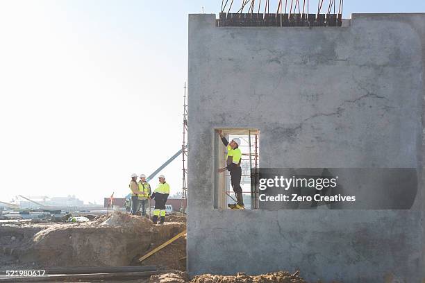 site manager checking doorway on construction site - doorway stock pictures, royalty-free photos & images