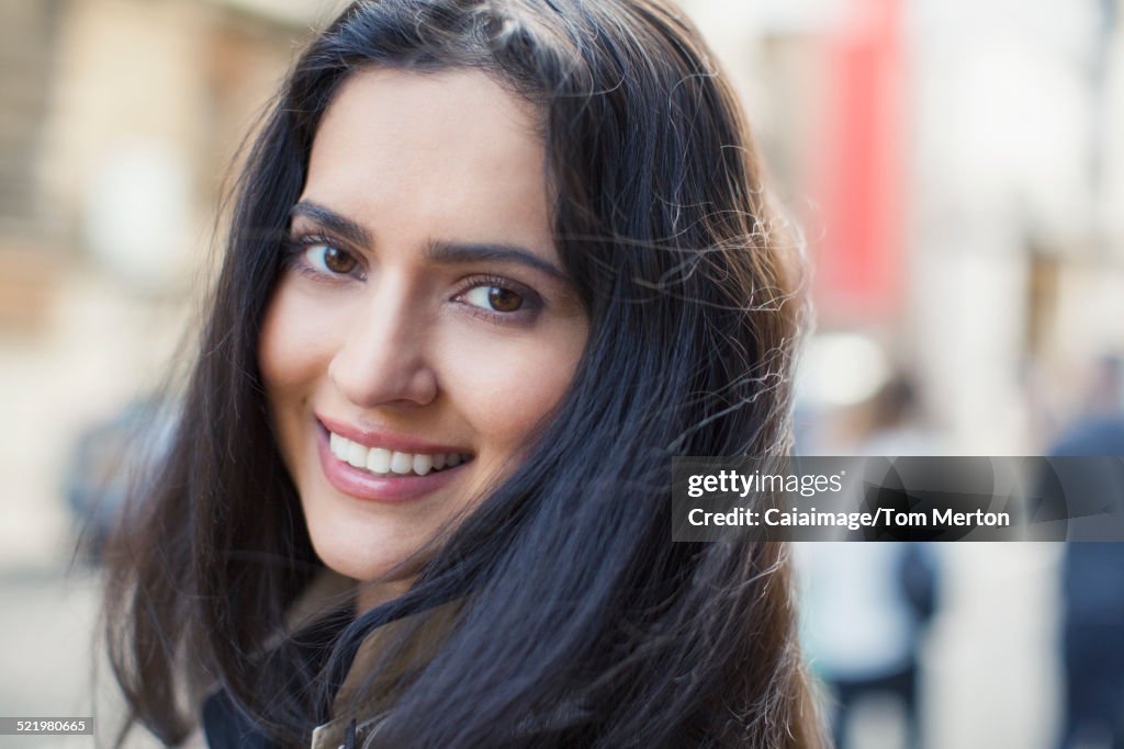 Woman smiling on city street