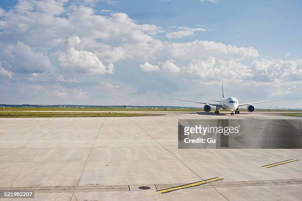 airplane on runway, paris, france - runway foto e immagini stock