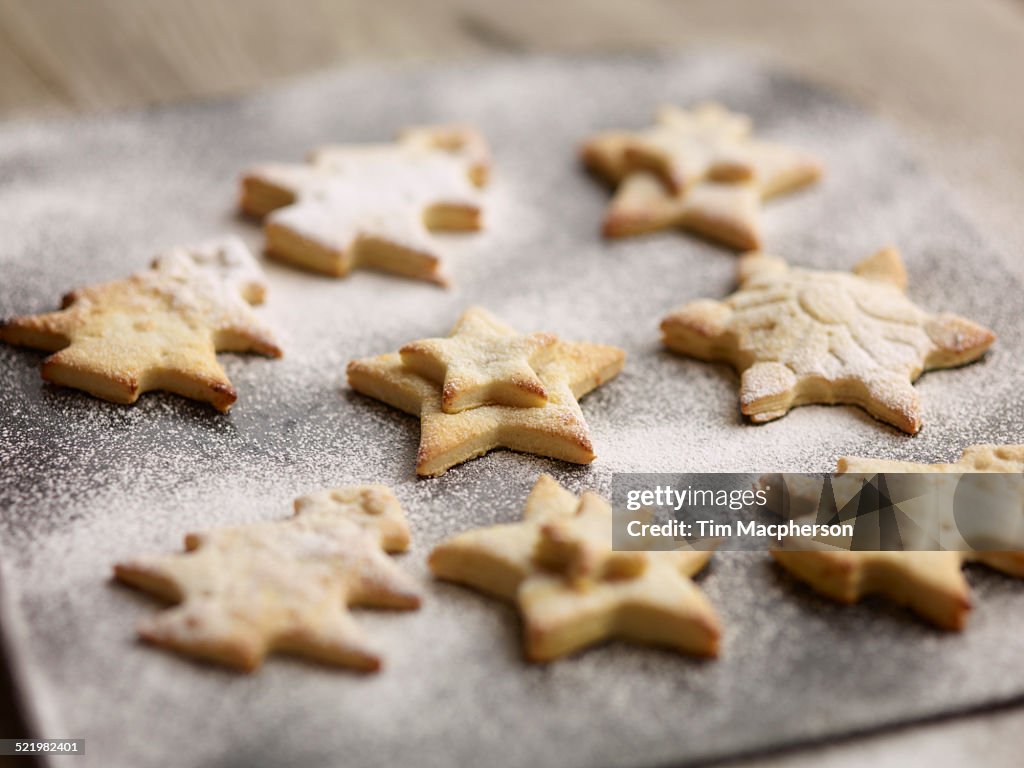 Close up of freshly baked christmas biscuits on baking tray