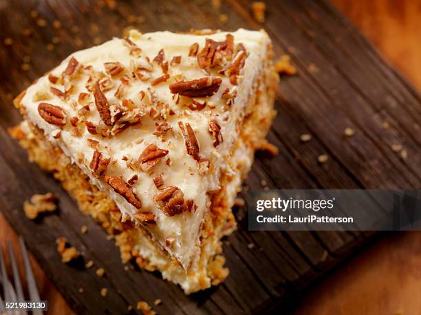 carrot cake with cream cheese icing - layer cake stock pictures, royalty-free photos & images