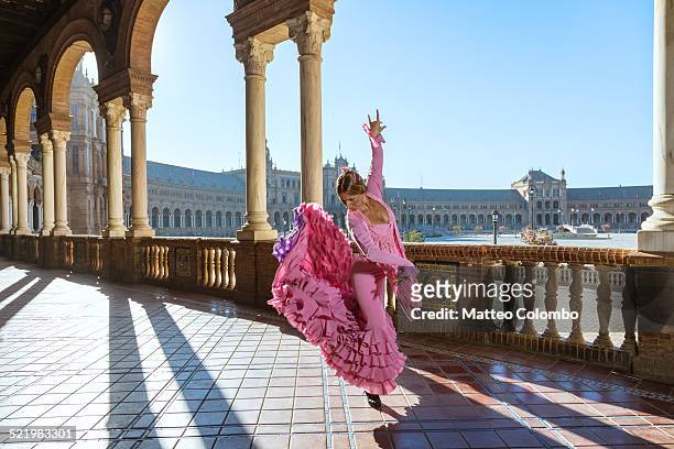 flamenco dancer performing outdoors in spain - seville stock-fotos und bilder