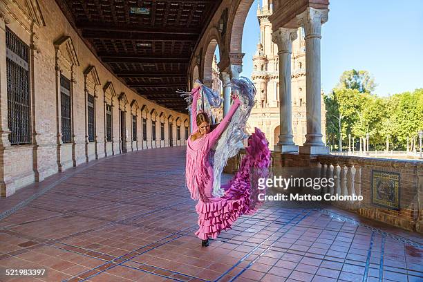 flamenco dancer performing outdoors, seville spain - flamencos stock-fotos und bilder