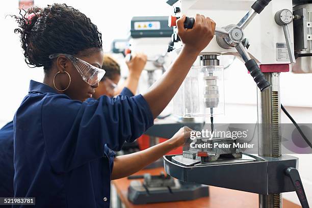 students using drilling machines in college workshop - england training session stock pictures, royalty-free photos & images