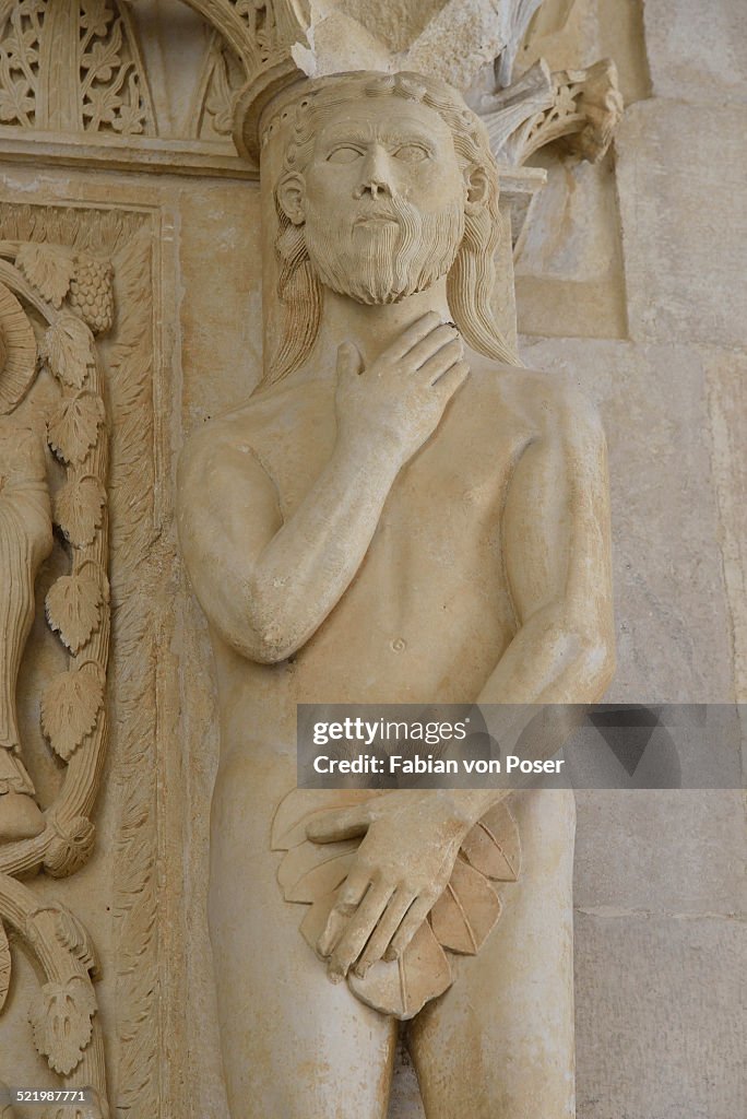 Adam with a fig leaf on the western gate of Trogir Cathedral or Cathedral of St. Lawrence, 13th century, by the artist Radovan, historic centre, Unesco World Heritage Site, Trogir, Dalmatia, Croatia