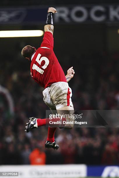 Welsh Captain Gareth Thomas celebrates as the final whistle blows during the Six Nations match between Wales and England at the Millennium Stadium on...